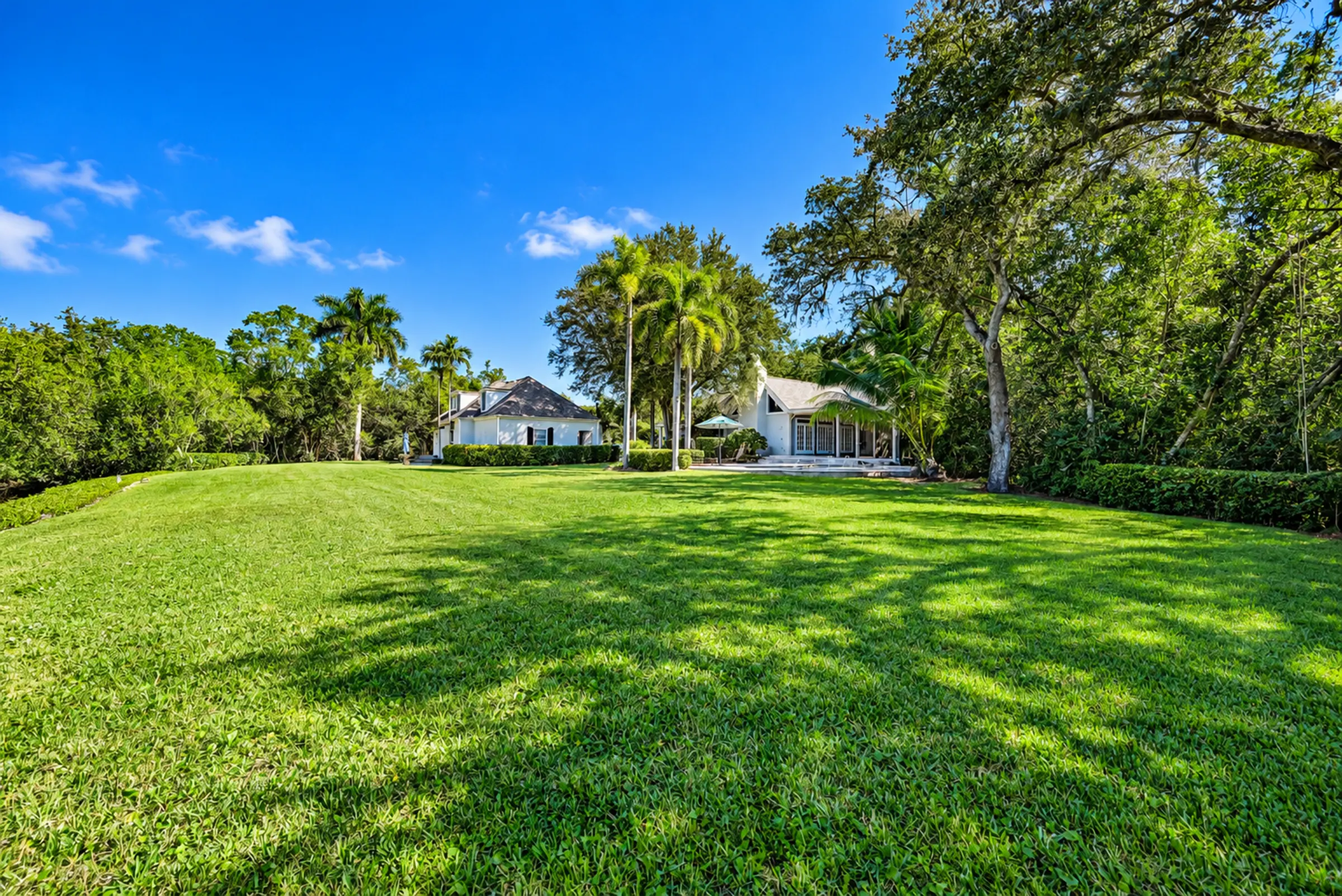 The broad lawn behind the residence
